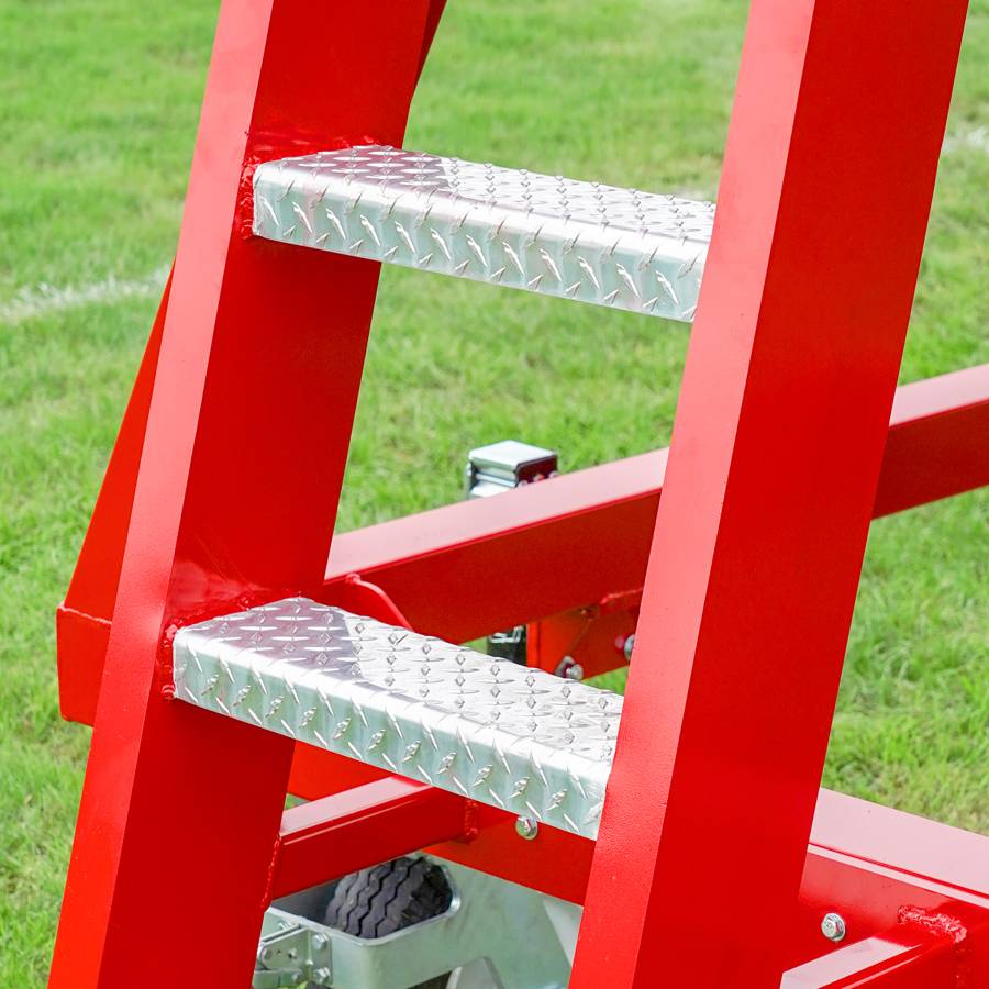 View of the stable ladder construction on the Kwik Goal 9B6501 portable scorer's tower featuring a custom colored aluminum and steel frame with a UV-resistant polycarbonate roof.
