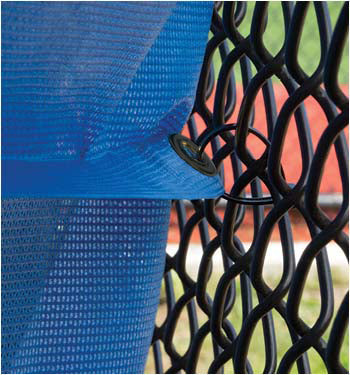 Fencemate windscreen - Close-up of blue mesh fabric with a textured black metal surface in the background