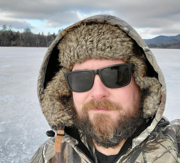 KEN MORLEY DURING WINTER IN THE ADIRONDACK SICE FISHING