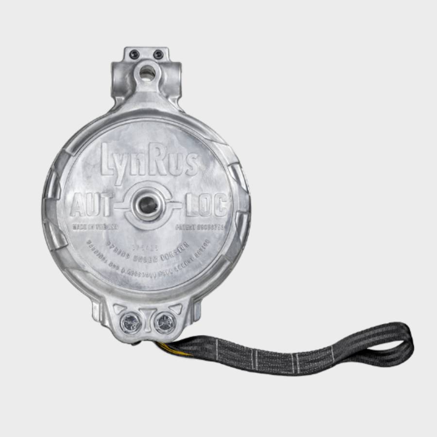 Close-up of the MA11482 Safestop backboard fall arrest device, highlighting the die-cast housing, mounting brackets, and heavy-duty retractable safety belt.