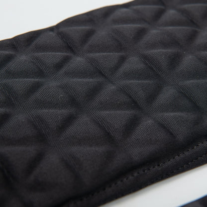 Close-up detail of the Tri-Flex cushion system on the forearm sleeve, clearly displaying the individual triangular foam segments that allow the padding to bend and flex without restricting arm movement.