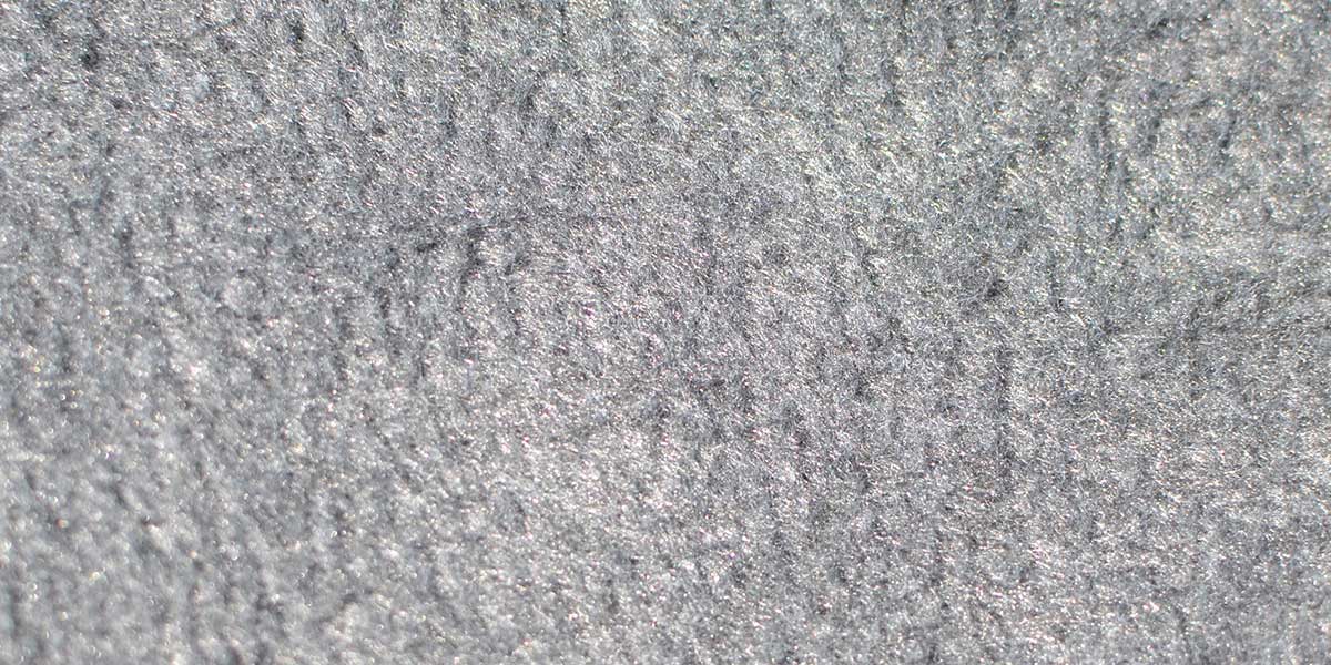 Close up of Fisher fleece lining material used in their fleece lined football sideline capes.