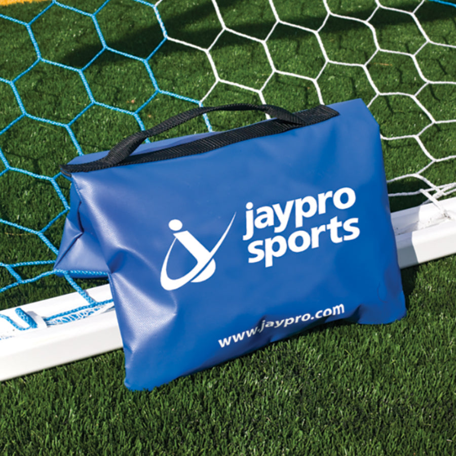 Blue Jaypro Sports sand bag on a soccer goalpost