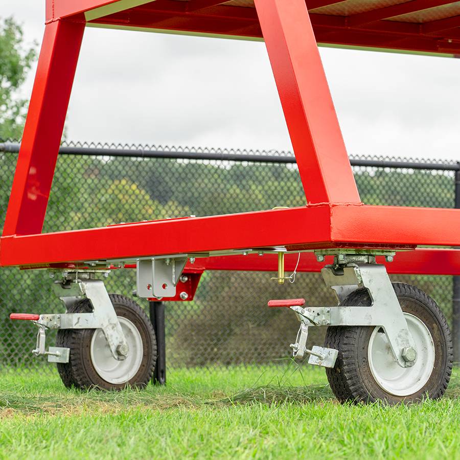 View of the durable wheels on the Kwik Goal 9B6501 portable scorer's tower featuring a custom colored aluminum and steel frame with a UV-resistant polycarbonate roof.