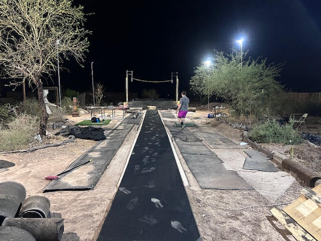 Roll out runway set up as a pole vault runway for a backyard training area.